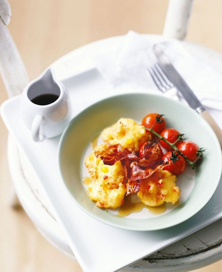 American corn fritters with bacon and roasted tomatoes