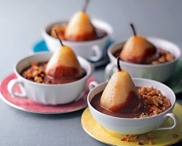 Individual pear and crumble puddings served in old-fashioned teacups