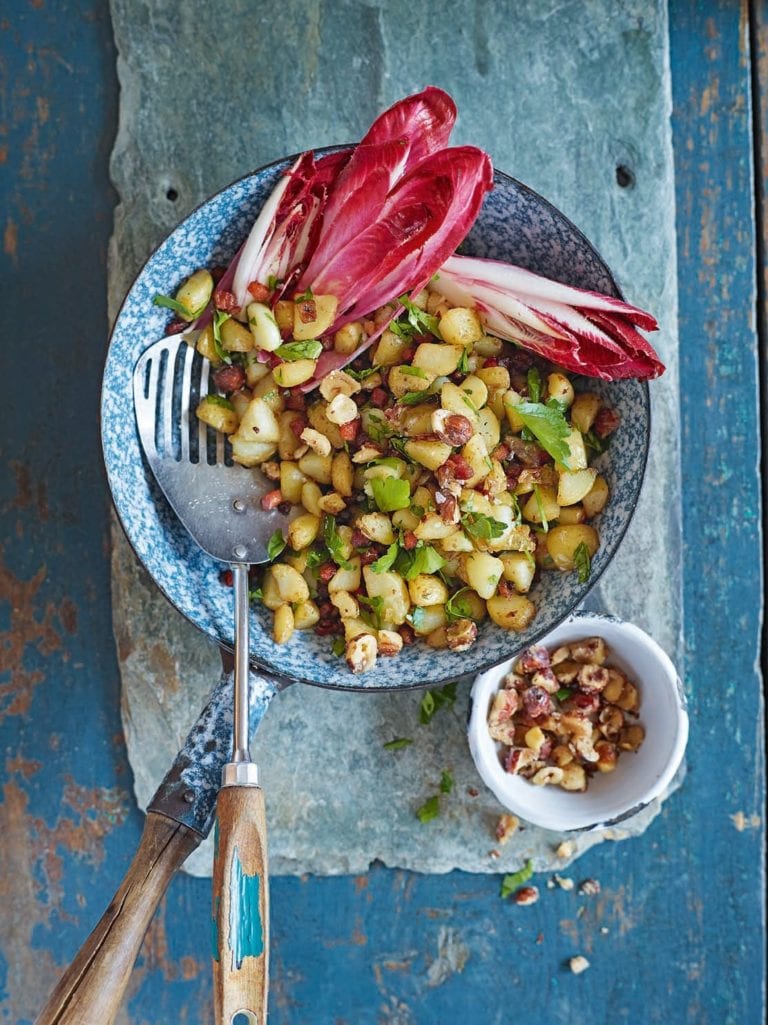 Jersey royal and pancetta hash with chicory and maple hazelnuts