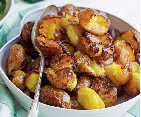 Charred baby potatoes with chilli butter