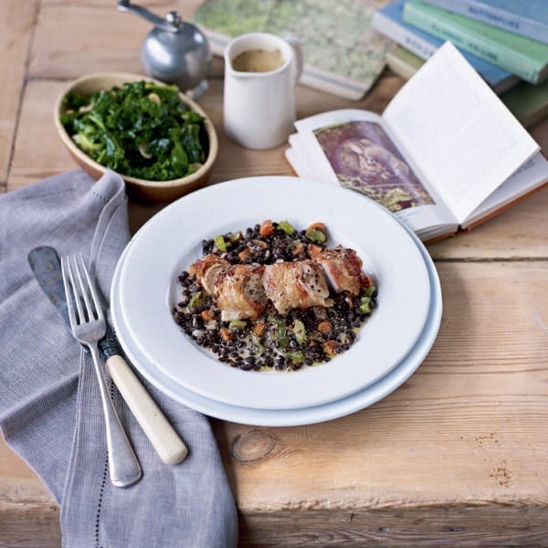 Rabbit loins wrapped with pancetta on braised puy lentils