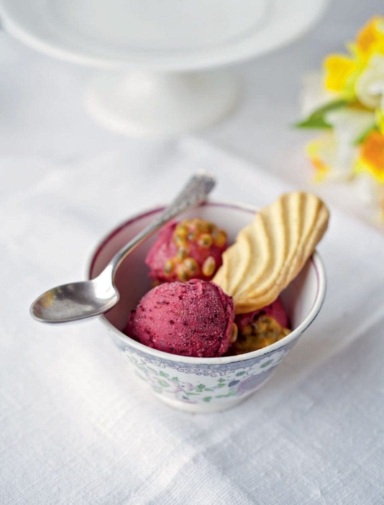 Frozen berry yogurt with passion fruit topping