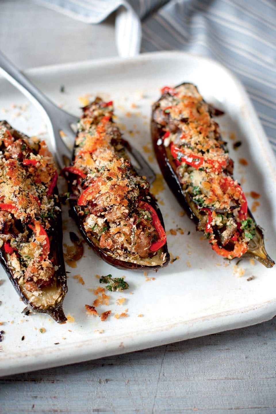 Sausage and herb stuffed aubergines recipe delicious. magazine