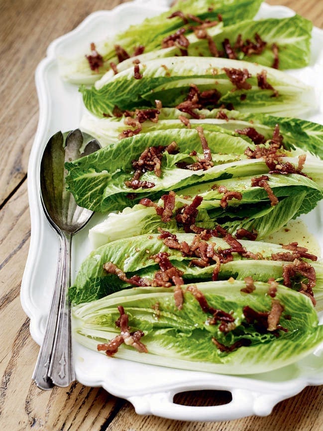 Crisp lettuce hearts with a hot bacon, maple syrup and garlic dressing