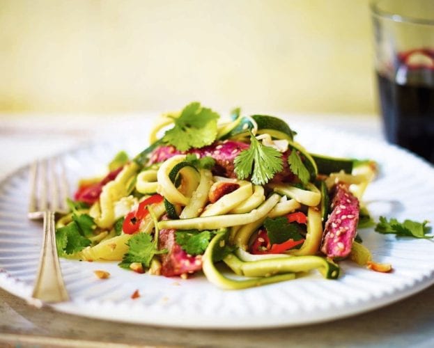 Asian-style courgetti with steak on a plate