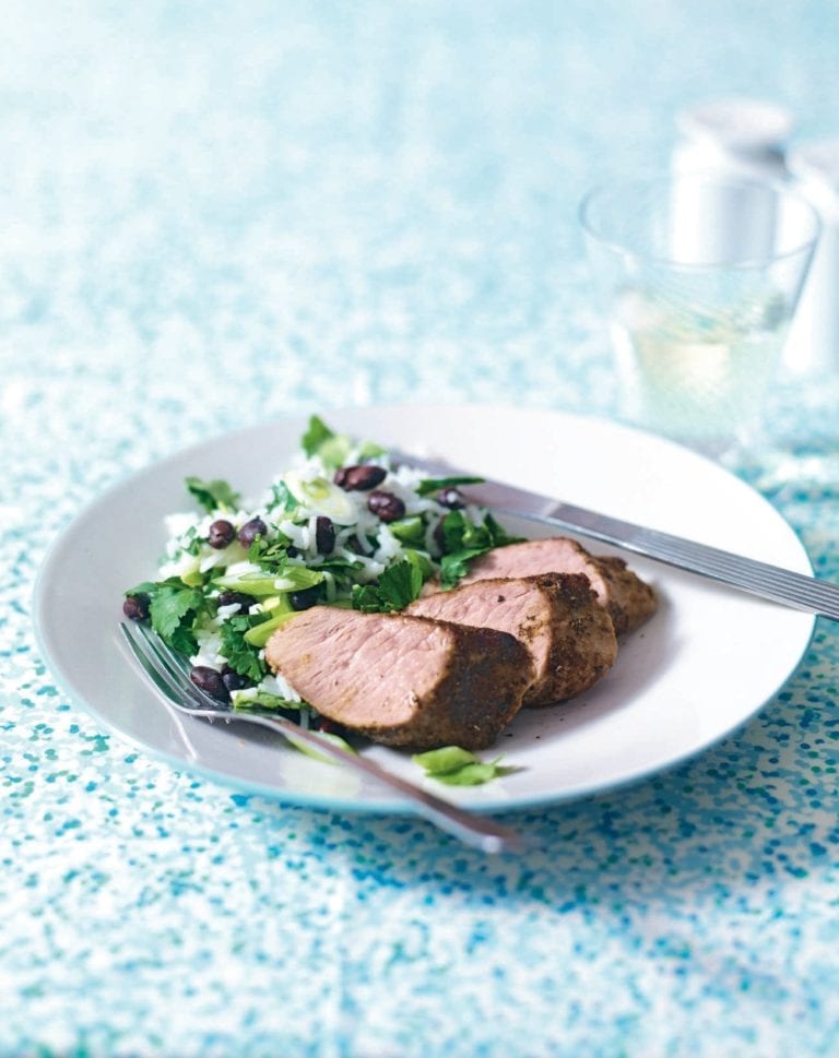 Quick and easy Cajun-style pork with coconut rice and beans