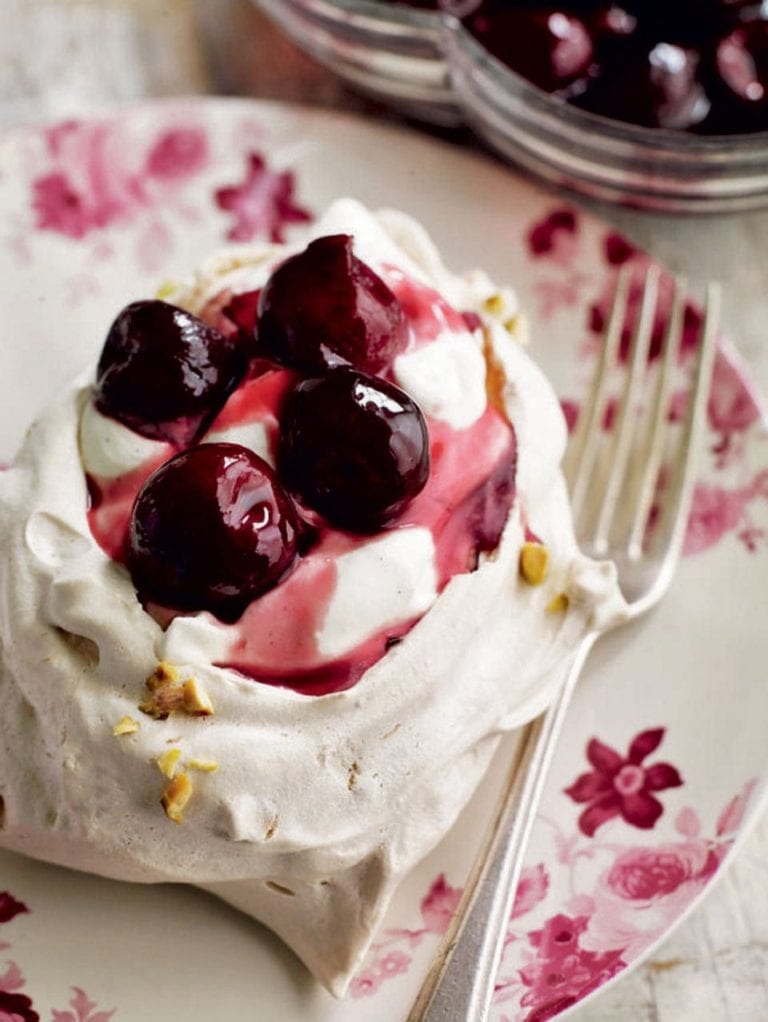 Pistachio pavlovas with cherry compote and vanilla yoghurt cream