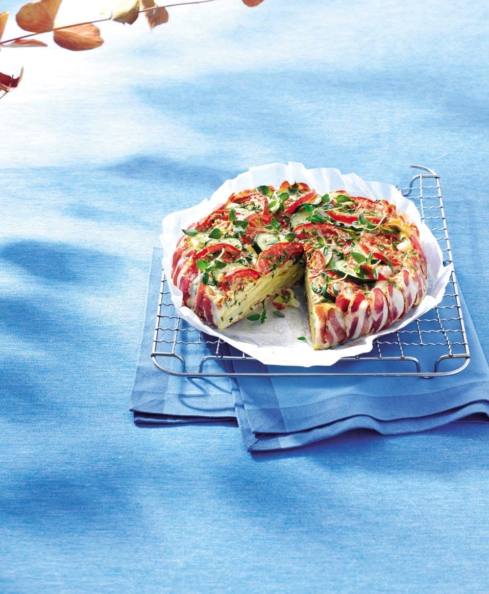 Pancetta-wrapped tomato, courgette and Emmental tart recipe | delicious. magazine