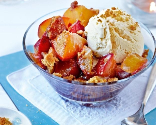 Cinnamon and berry-stuffed baked apples with maple syrup