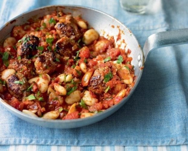 Pork sausage meatballs in a silver frying pan