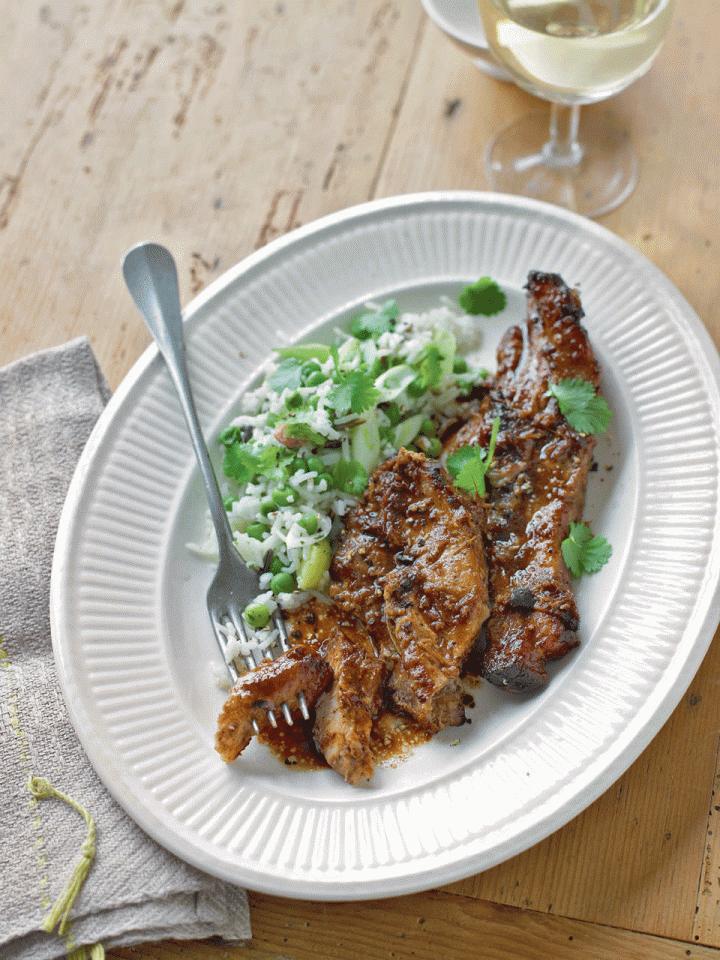 Five-spice slow-roast pork belly with pea and leek pilaf