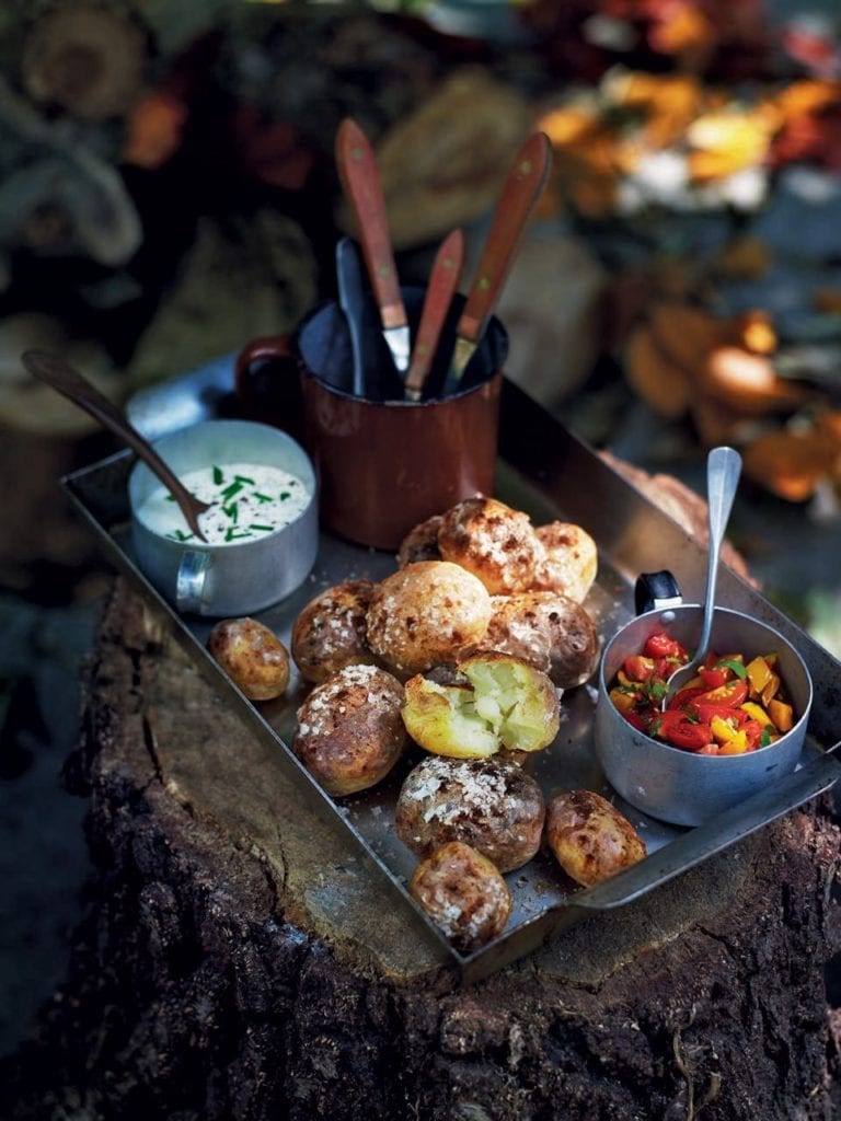 Fire-baked potatoes with soured cream and fiery salsa