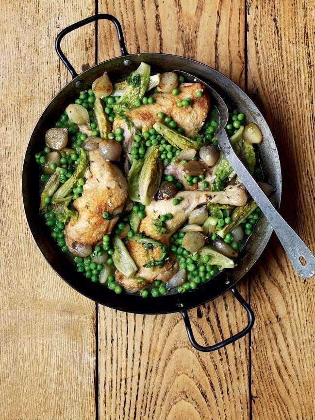 Braised chicken legs with baby onions, lettuce and peas