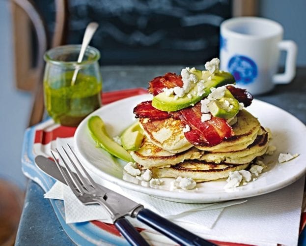 Fluffy American pancakes with bacon and avocado