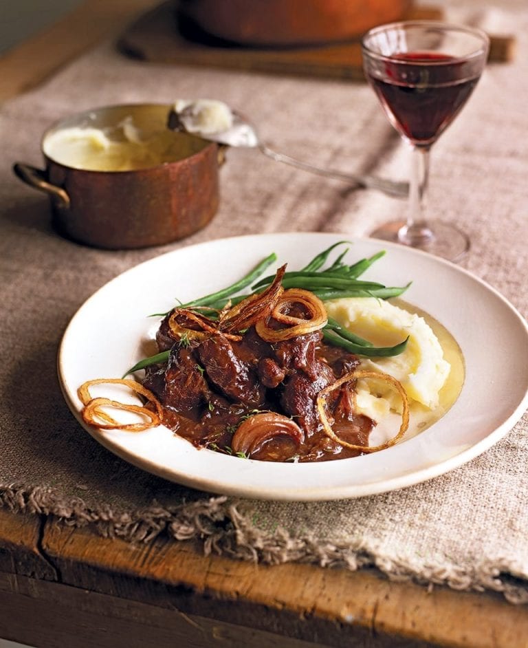 Braised venison with prunes, port and crispy onions