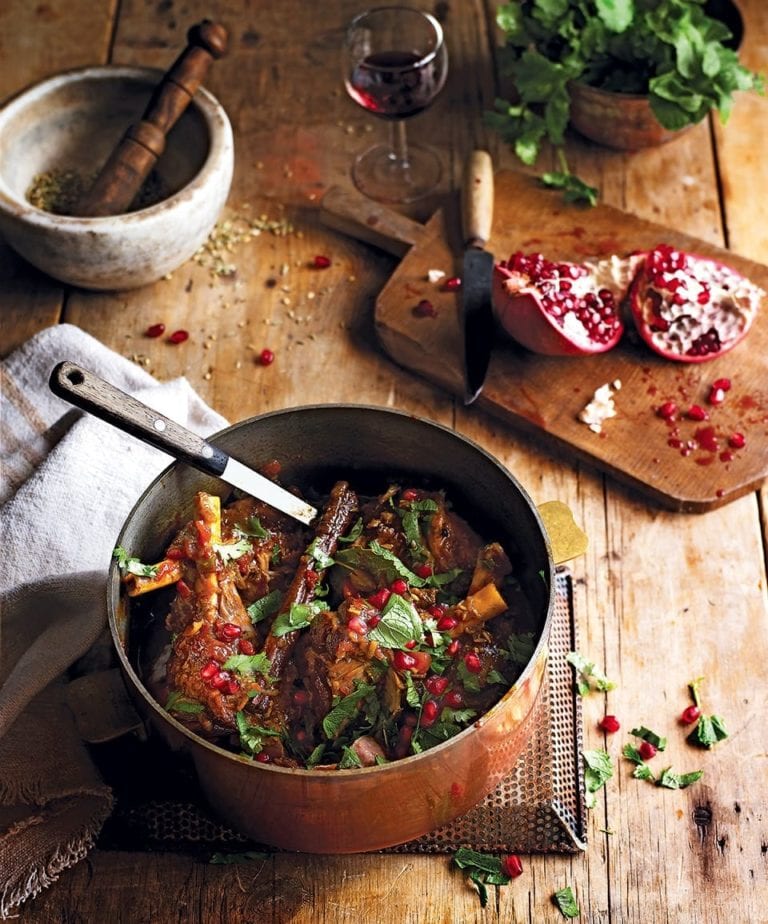 Slow-cooked Indian spiced lamb shanks with pomegranate