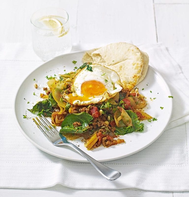 Spiced lamb mince with onions, chard and fried eggs