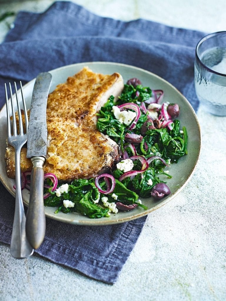 Wilted spinach with crumbed pork cutlets