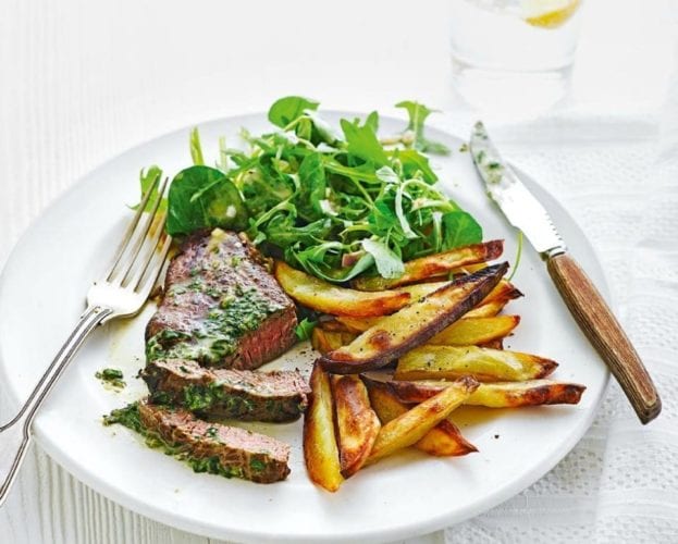 Steak frites (steak and chips) recipe, served on a white plate