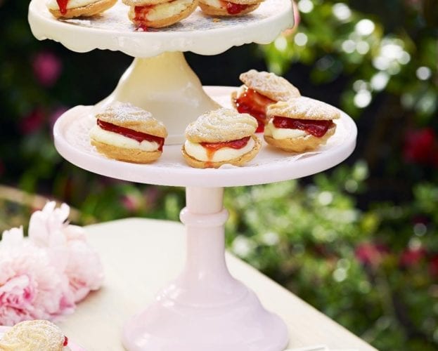 Lemon and strawberry viennese whirls on a cake stand