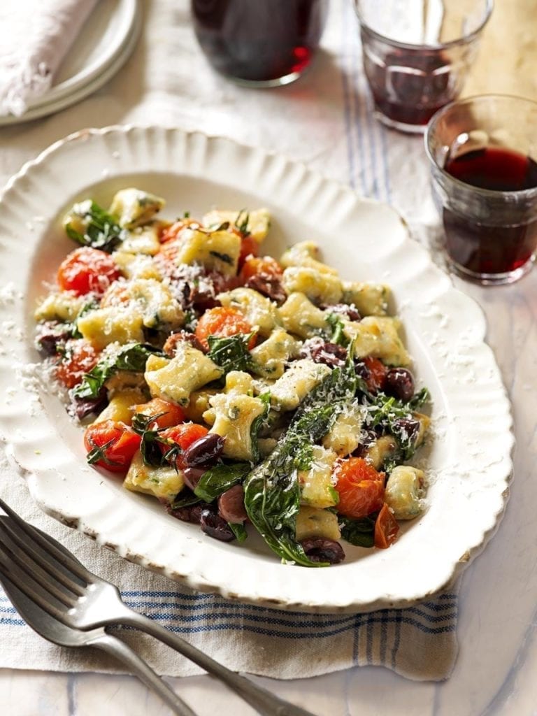 Spinach gnocchi with blistered tomatoes, basil and olives