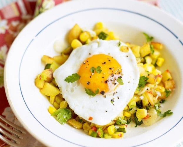 Sweetcorn, courgette and potato hash with fried egg