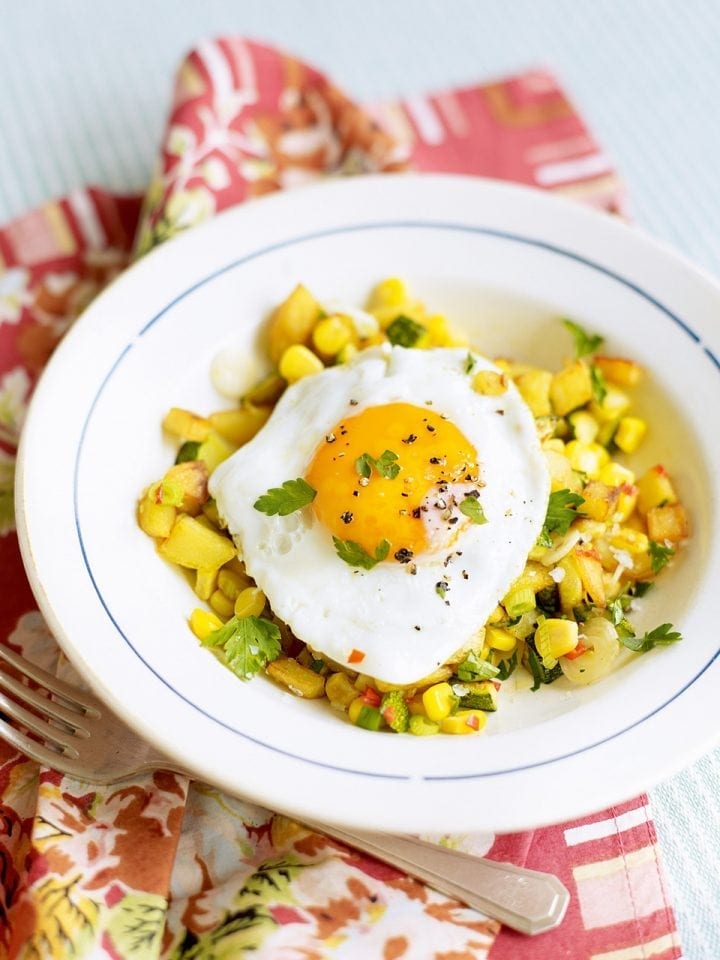 Sweetcorn, courgette and potato hash with fried egg