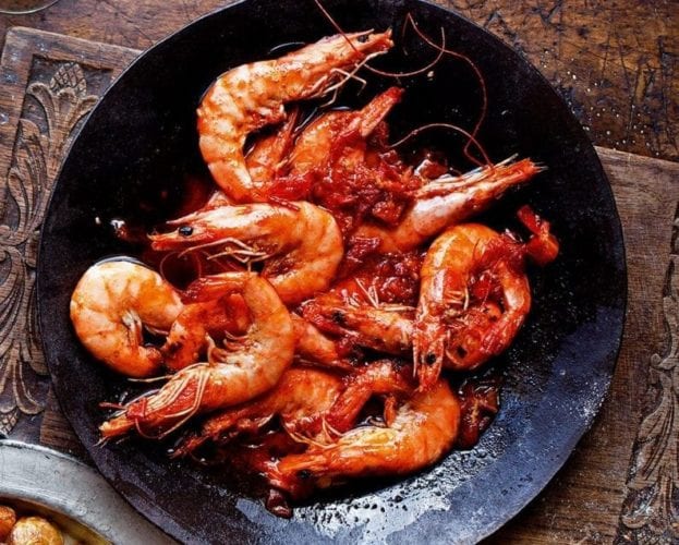 King prawns with garlic and chilli (gambas) in a black fry pan