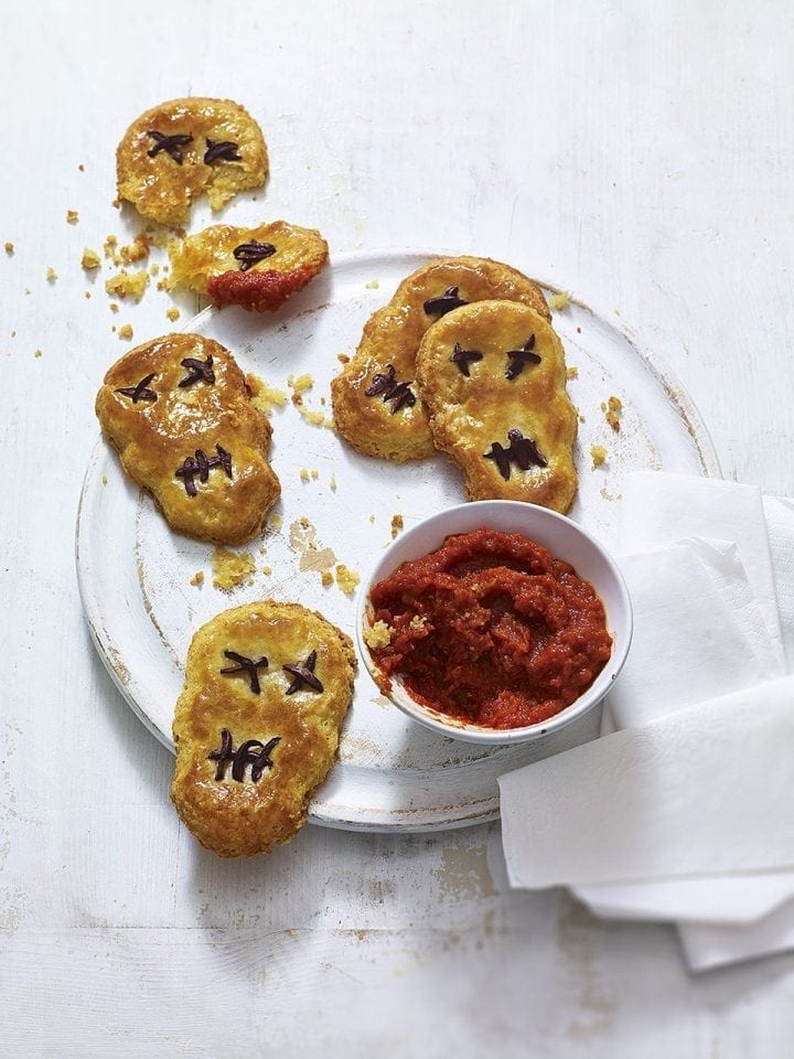 Cheese biscuit skulls with tomato dipping sauce