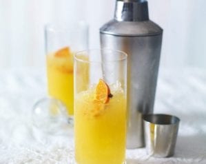 Clementine pisco sour in a high ball