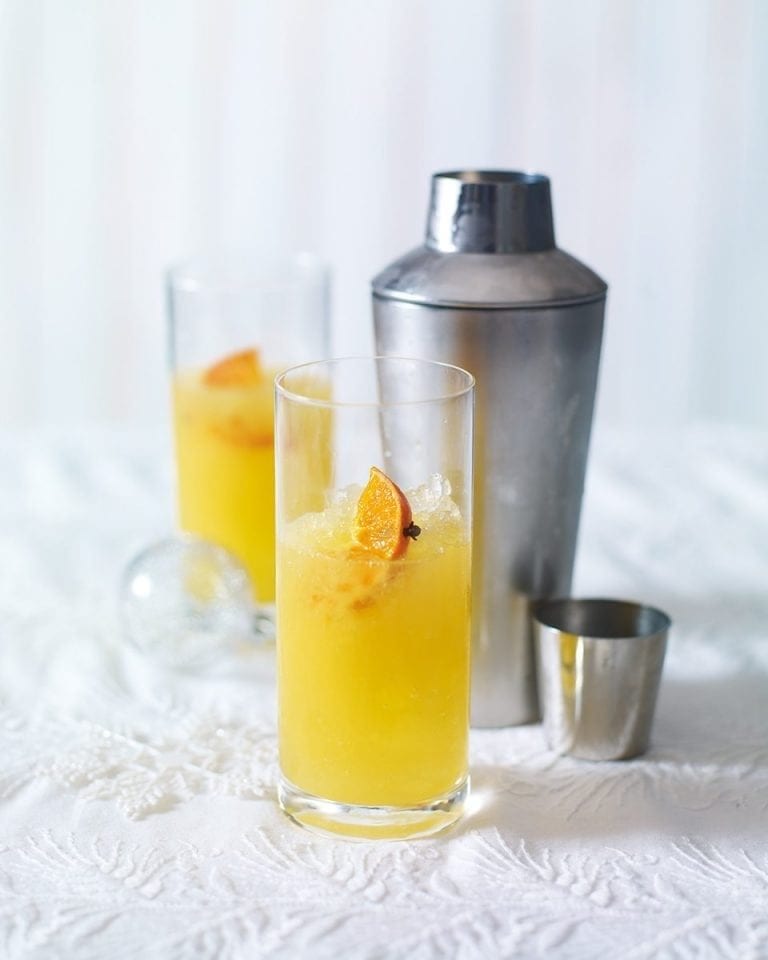 Clementine pisco sour in a high ball