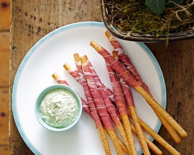 Parma ham-wrapped grissini with pesto dip