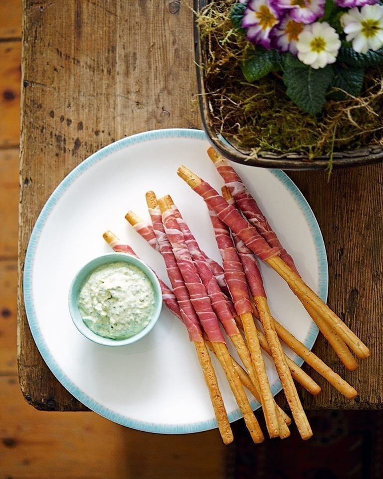 Parma ham-wrapped grissini with pesto dip