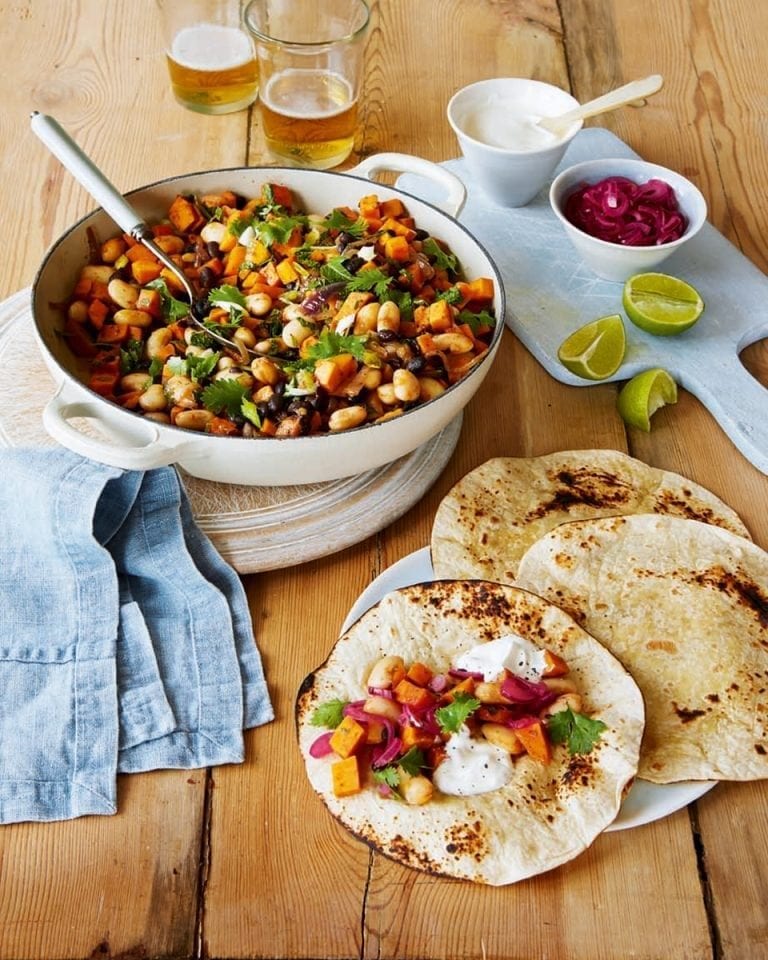 Smoky bean and sweet potato tortillas with lime-pickled onions