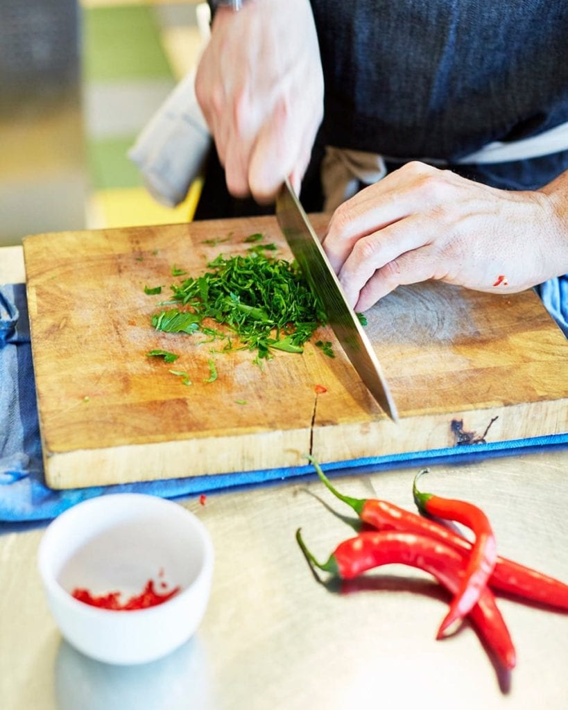 Image of herbs being chopped