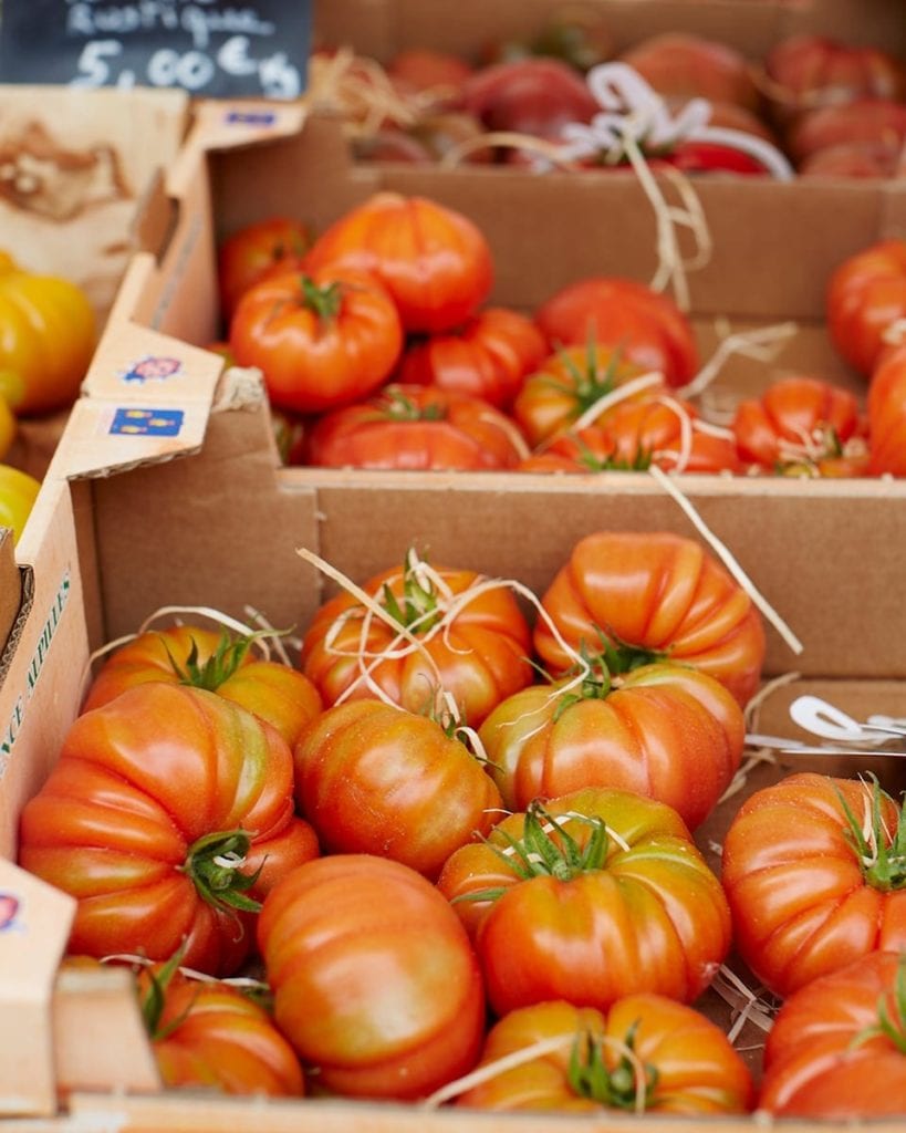 Image of large tomatoes at a market