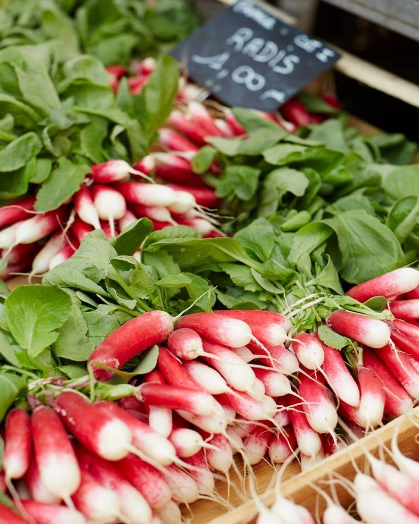 Image of pink radishes for sale at a French market