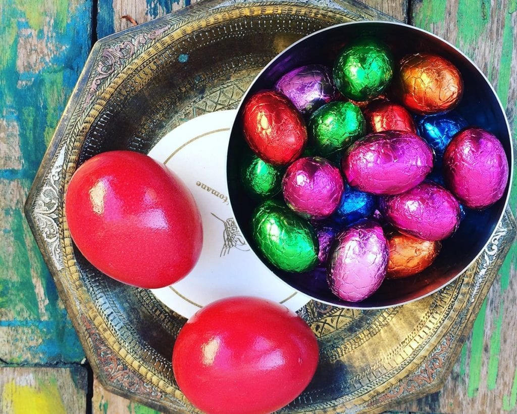 Image of chocolate Easter eggs and dyed eggs