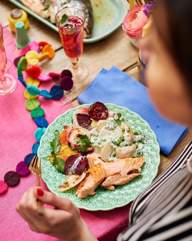 image of a plate of salmon, potato salad and beetroot salad