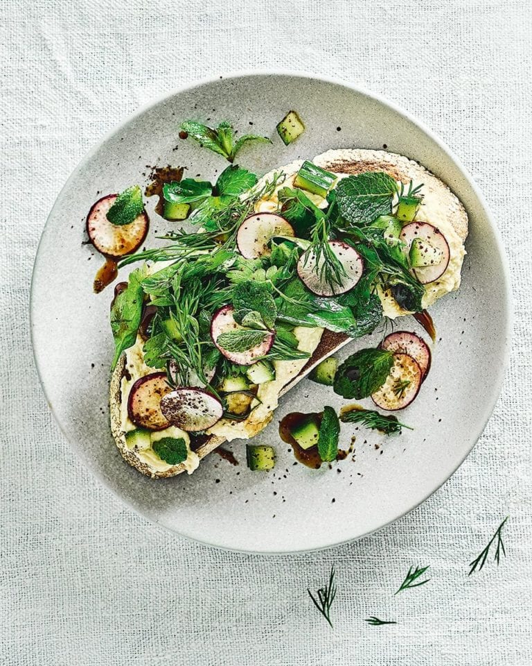 Houmous and herbs on toast
