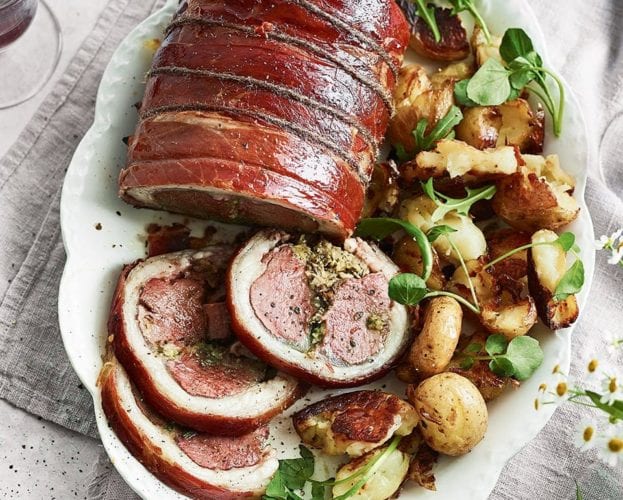Roast loin of lamb with braised peas and salsa verde
