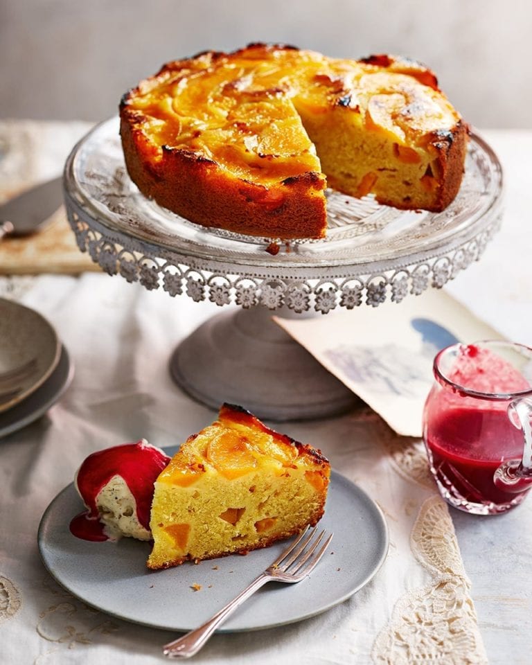 Peach cake with raspberry sauce and ice cream