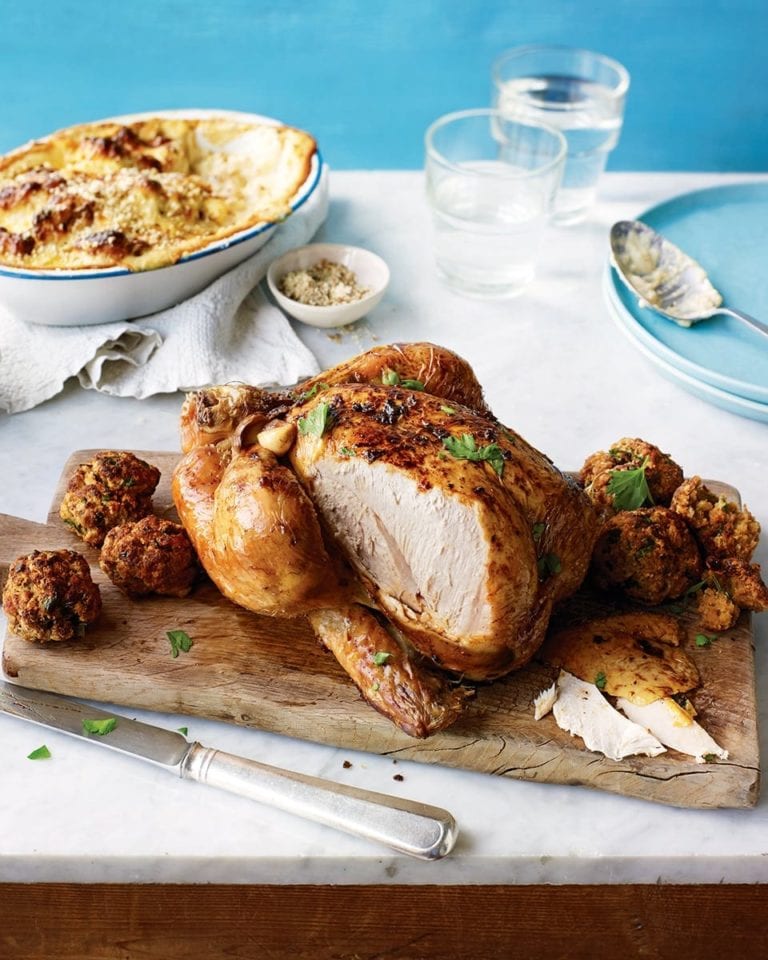 Roast chicken with buttery stuffing balls