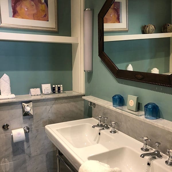 Image of double sinks in hotel bathroom