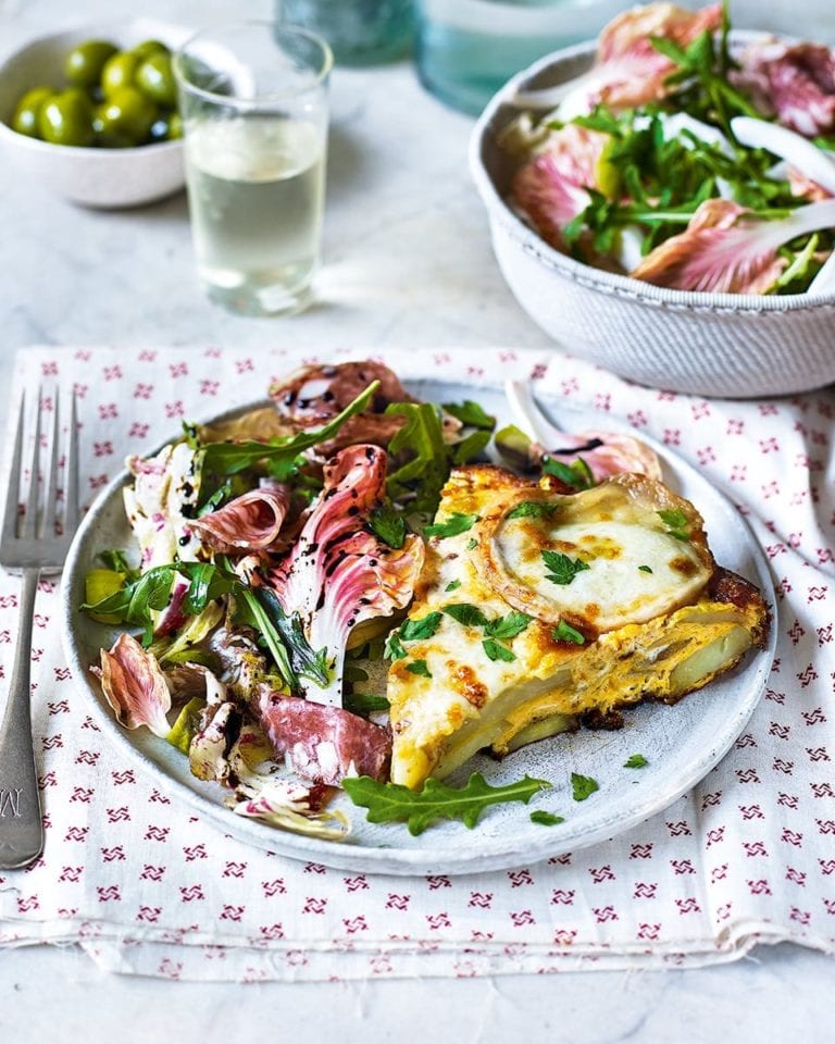 Cheesy potato frittata with radicchio, salami and olive salad