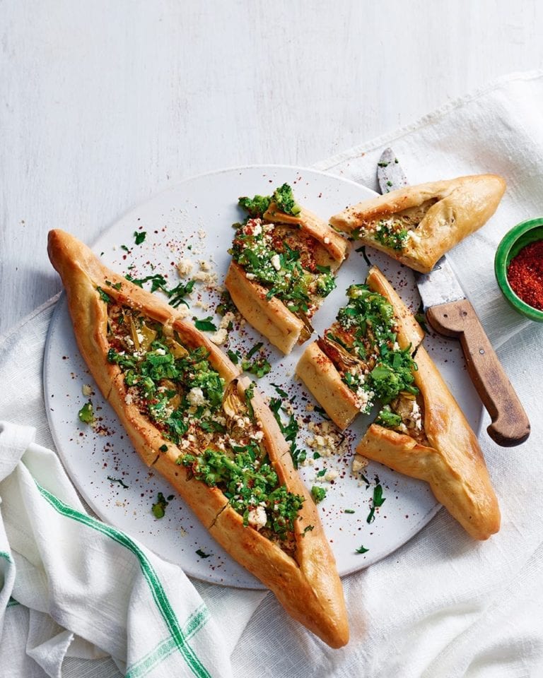 Turkish pide with marinated artichokes, broccoli and cheese