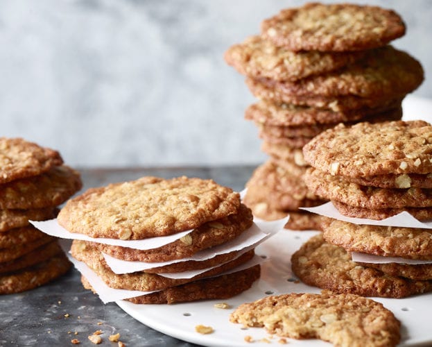Anzac biscuits stacked up on a plate