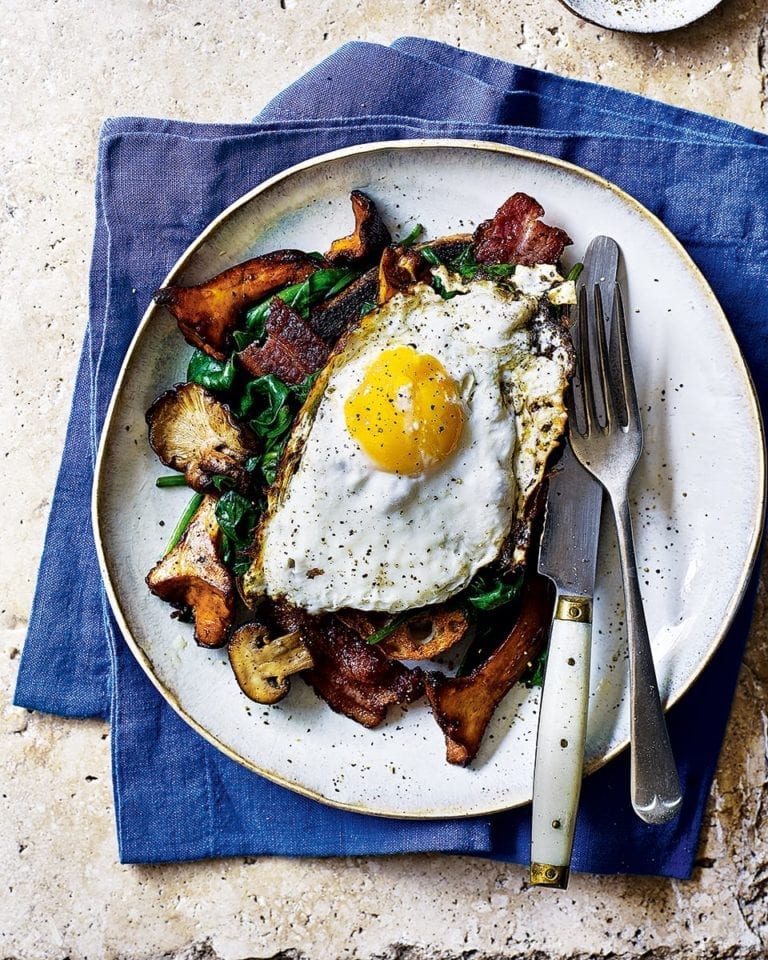 Fried mushrooms, crispy bacon and egg on sourdough toast