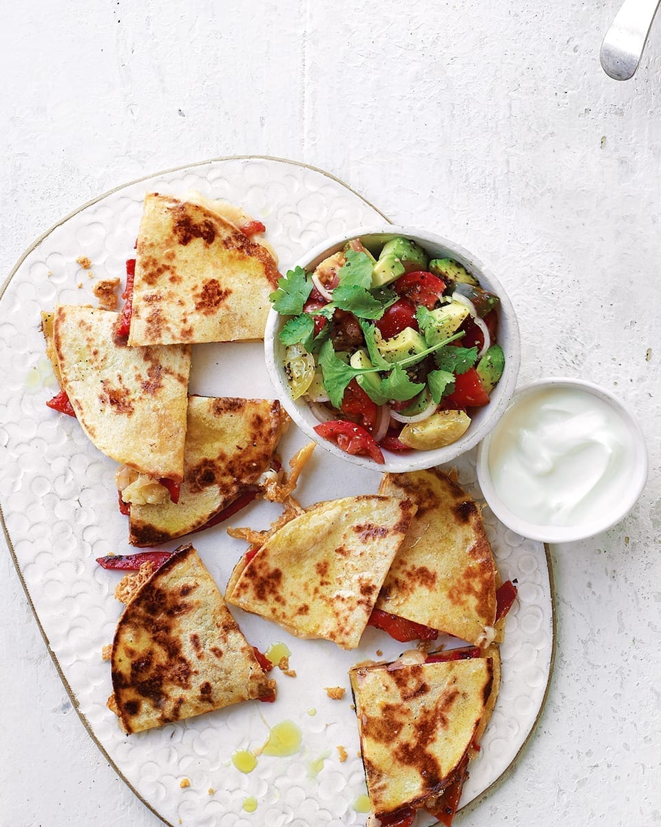 Cheesy quesadillas with tomato, red pepper and avocado salsa recipe | delicious. magazine
