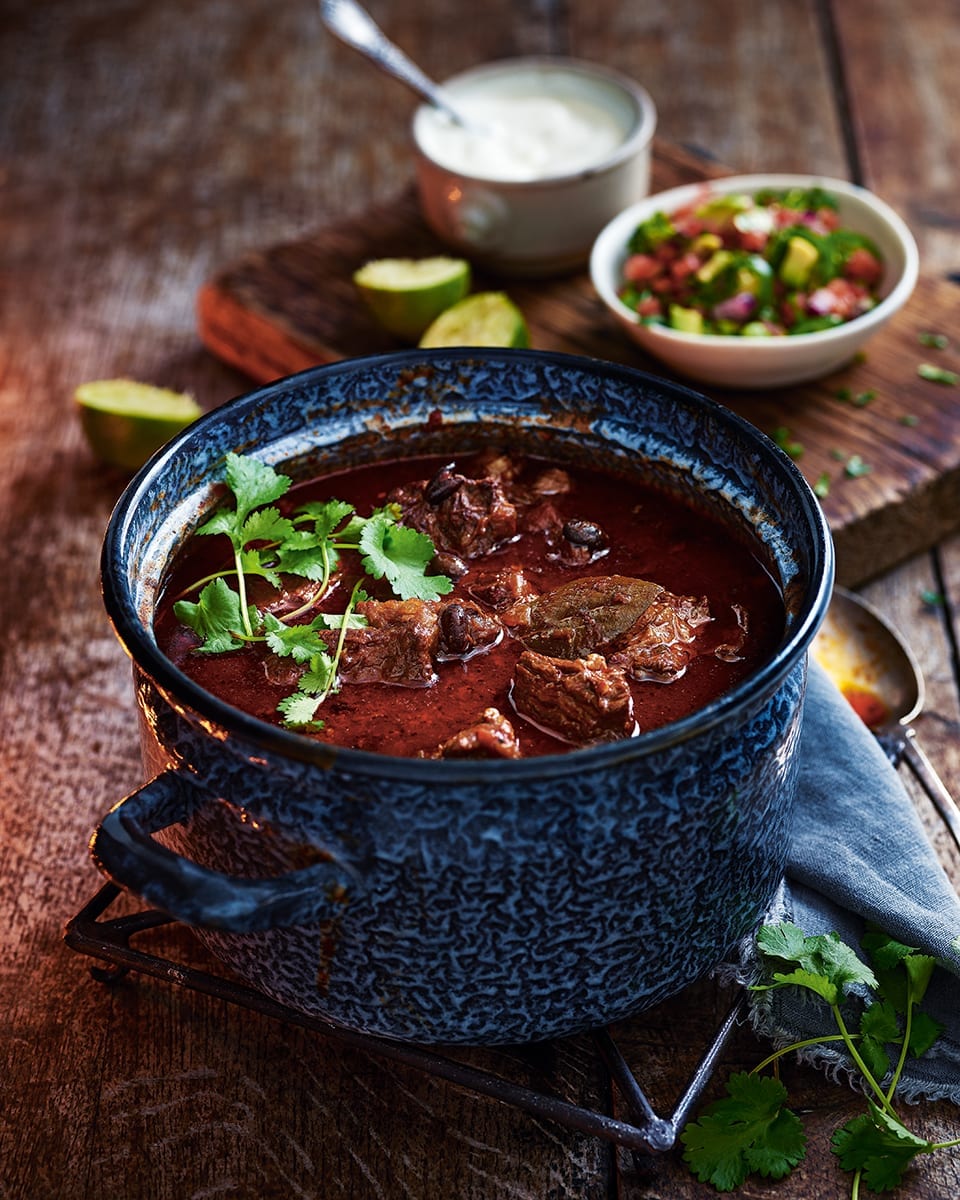 Real black bean chilli con carne with avocado and lime salsa recipe